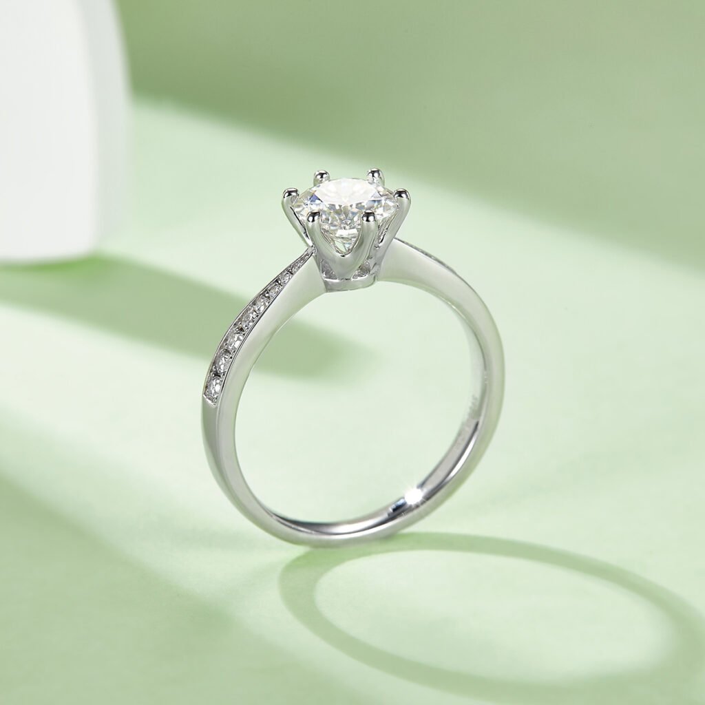 Solitaire-style moissanite ring with a stone-set band